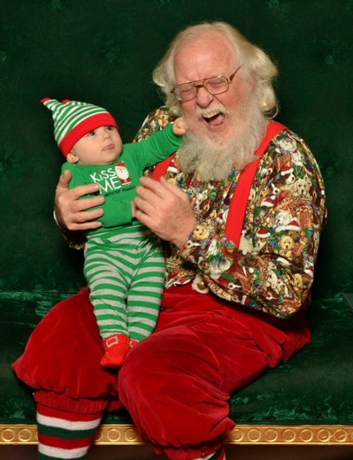 Baby pulling Santa's Beard